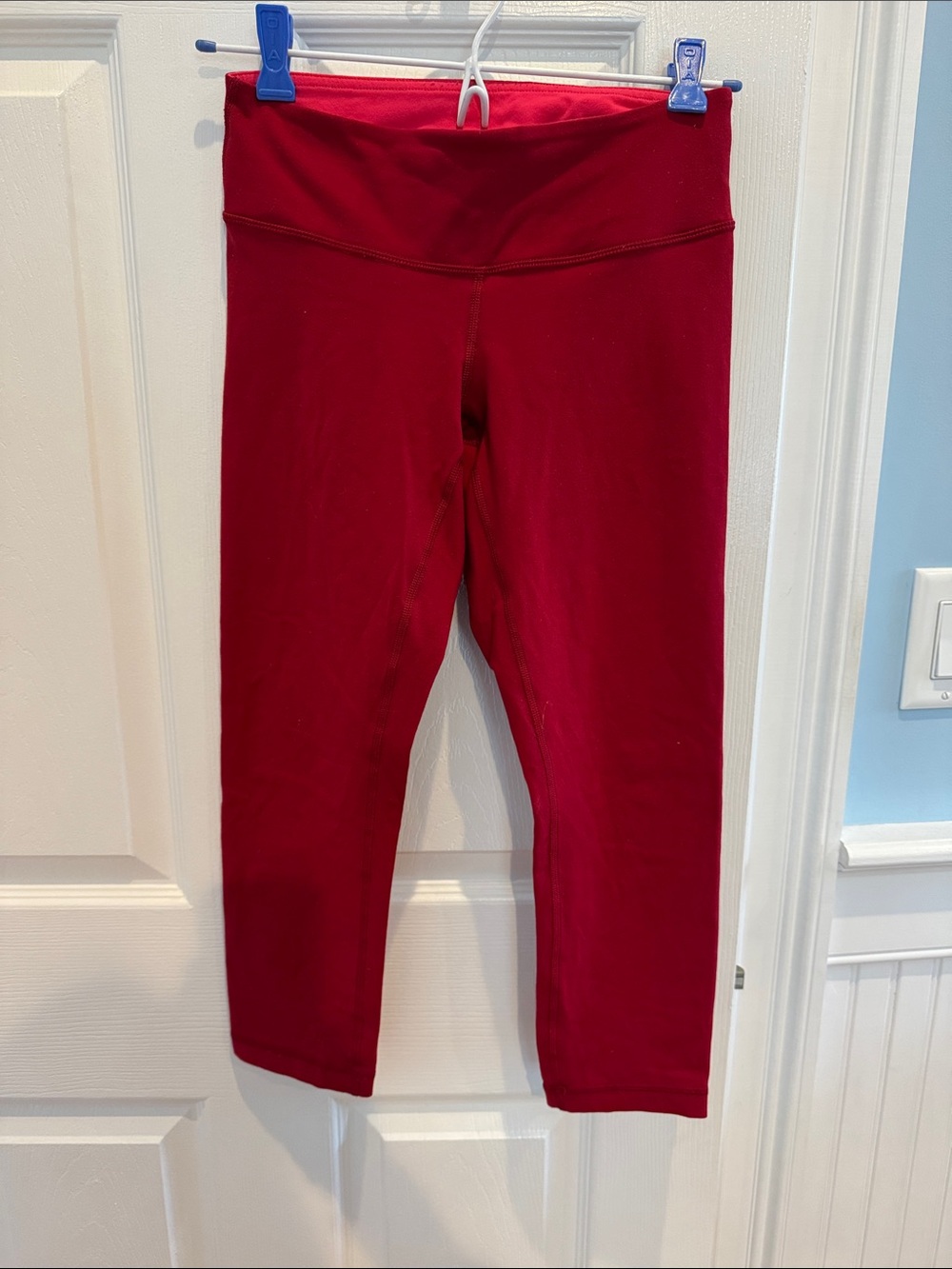 lululemon athletica cropped red leggings with pink interior waistband. Size 4